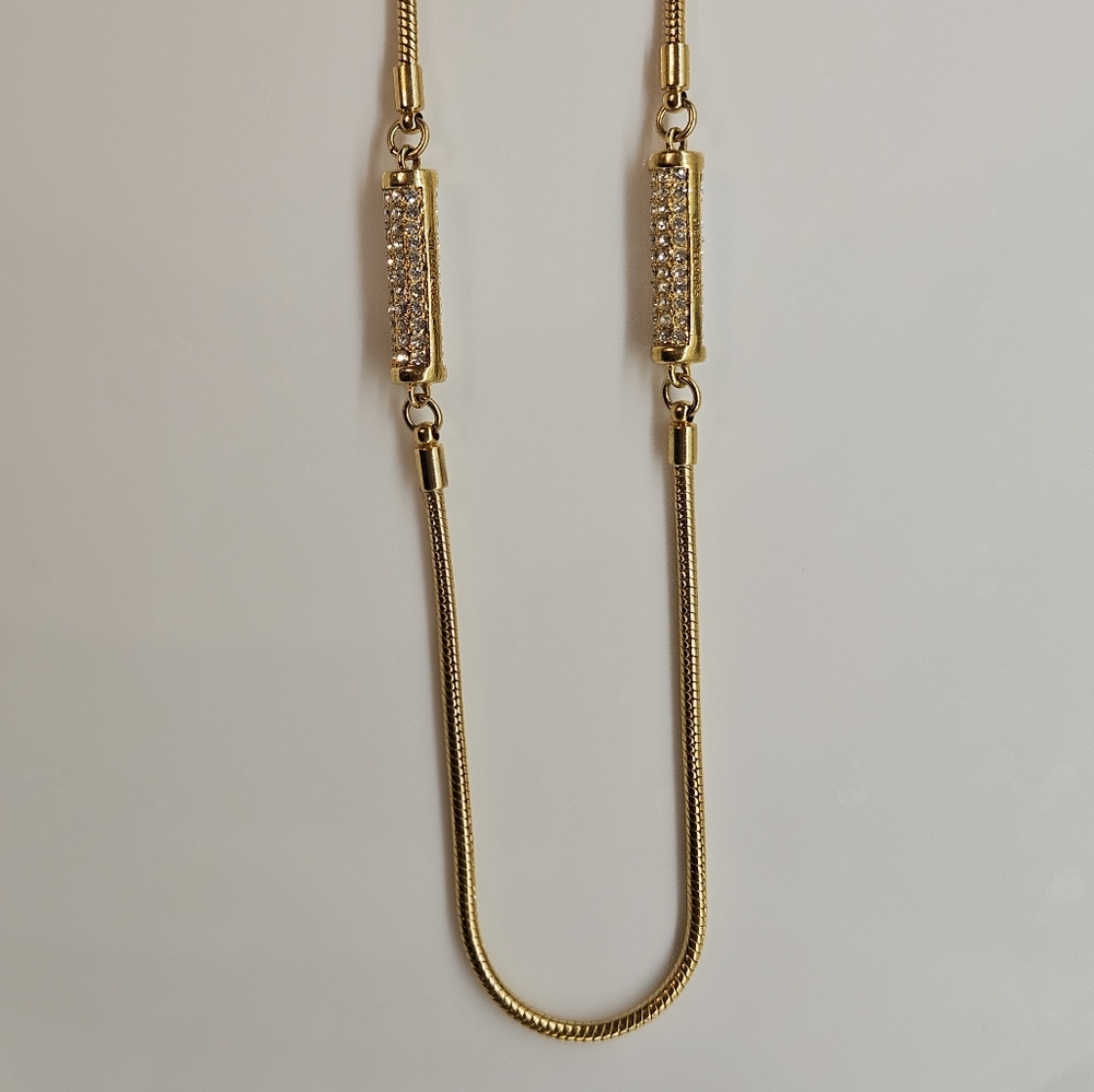Michael Kors Necklace - Long gold measuring 24 inches when hooked.